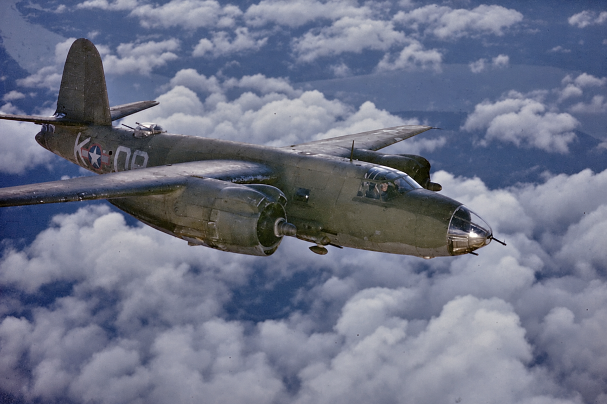 A B-26 Marauder in olive drab and bare aluminum flies above a subdued cloudscape, reflecting the palette of the Ringo Reiner Standard Collection.