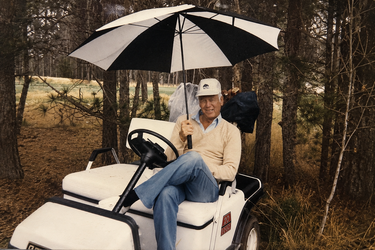 Ringo Reiner sitting in old EZGO golf cart at Oak Hills CC